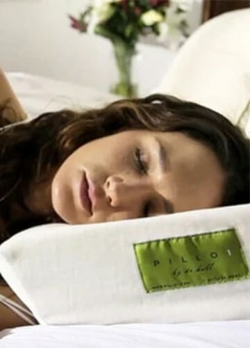 brunette sleeping woman lying on her side on a pillo1 pillow